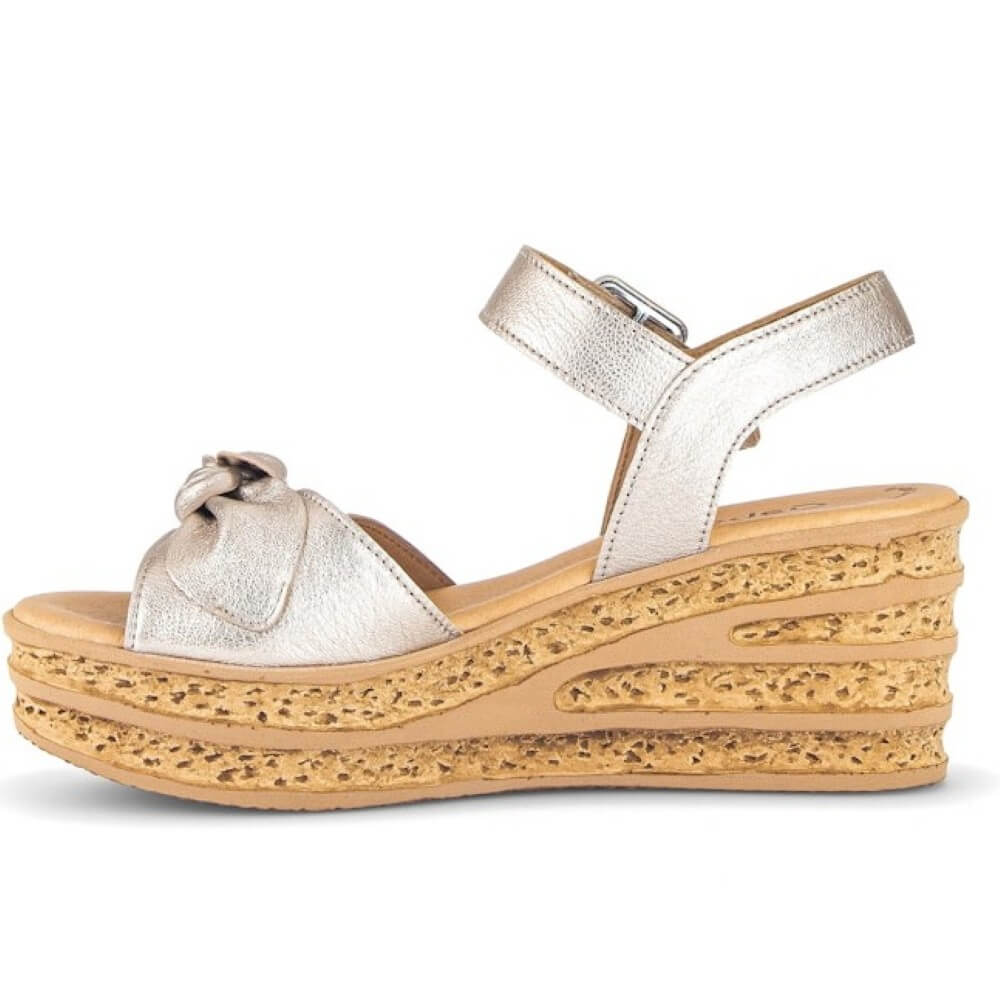 Gabor Gold wedge sandals with a bow on a white background