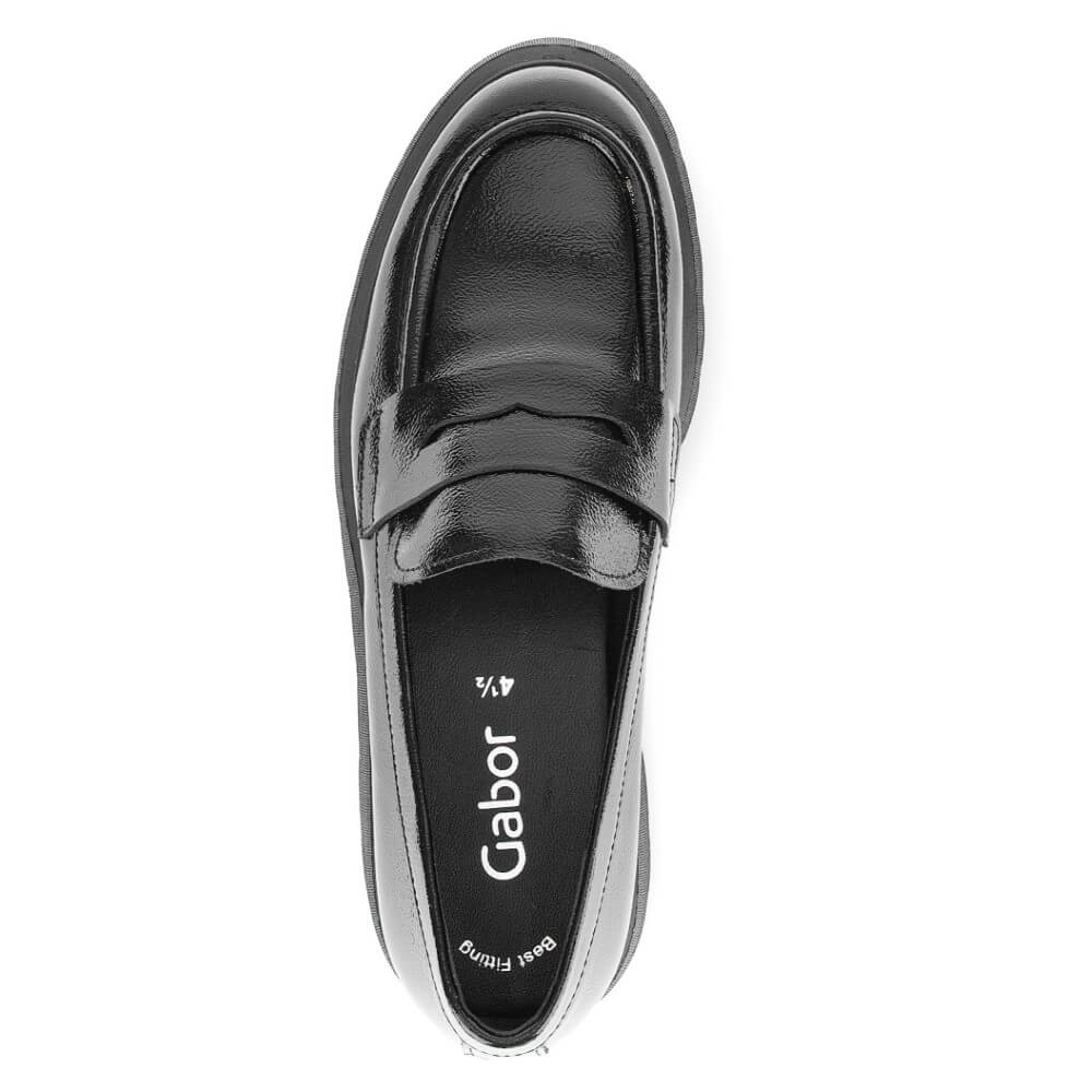 A single black leather penny loafer shown from a top-down view on a plain white background. The brand name 'Gabor' is printed in white on the black insole.