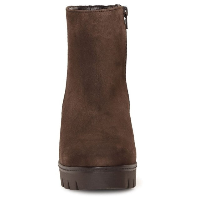 A dark brown suede ankle boot with a side zipper and a chunky dark sole, shown from a front-facing perspective on a white background.