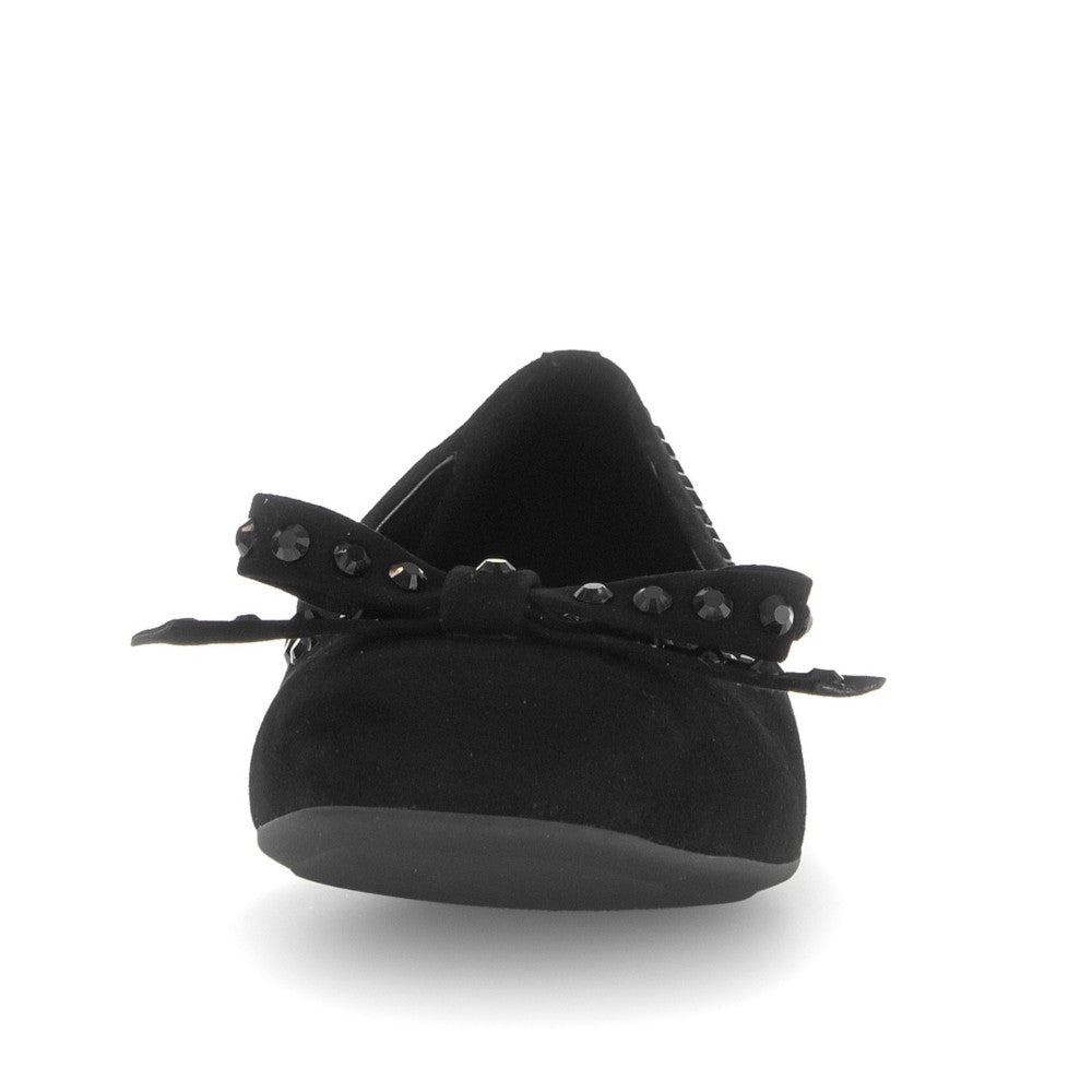 Black flat shoe with decorative elements on a white background