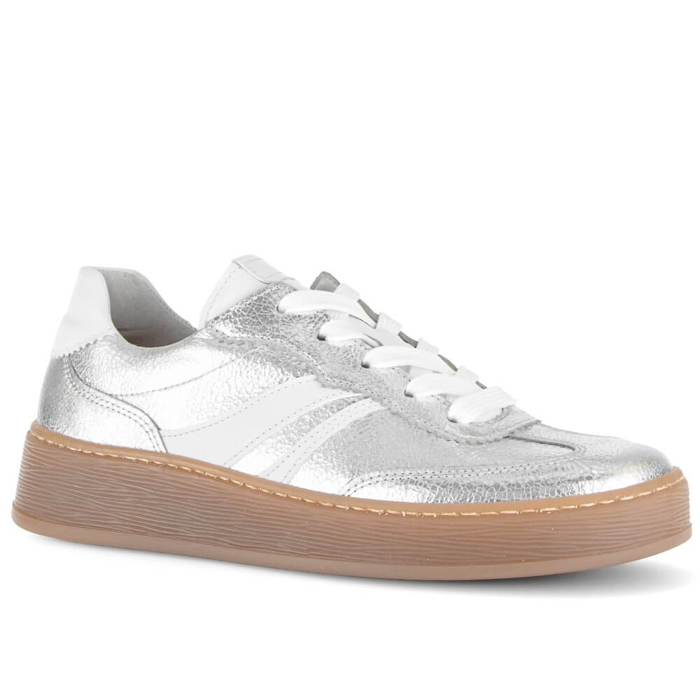 Silver trainer with white stripes on a brown rubber sole