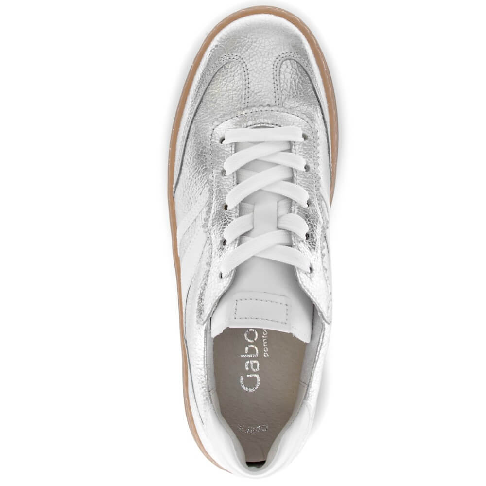 Silver sneaker with white laces on a white background