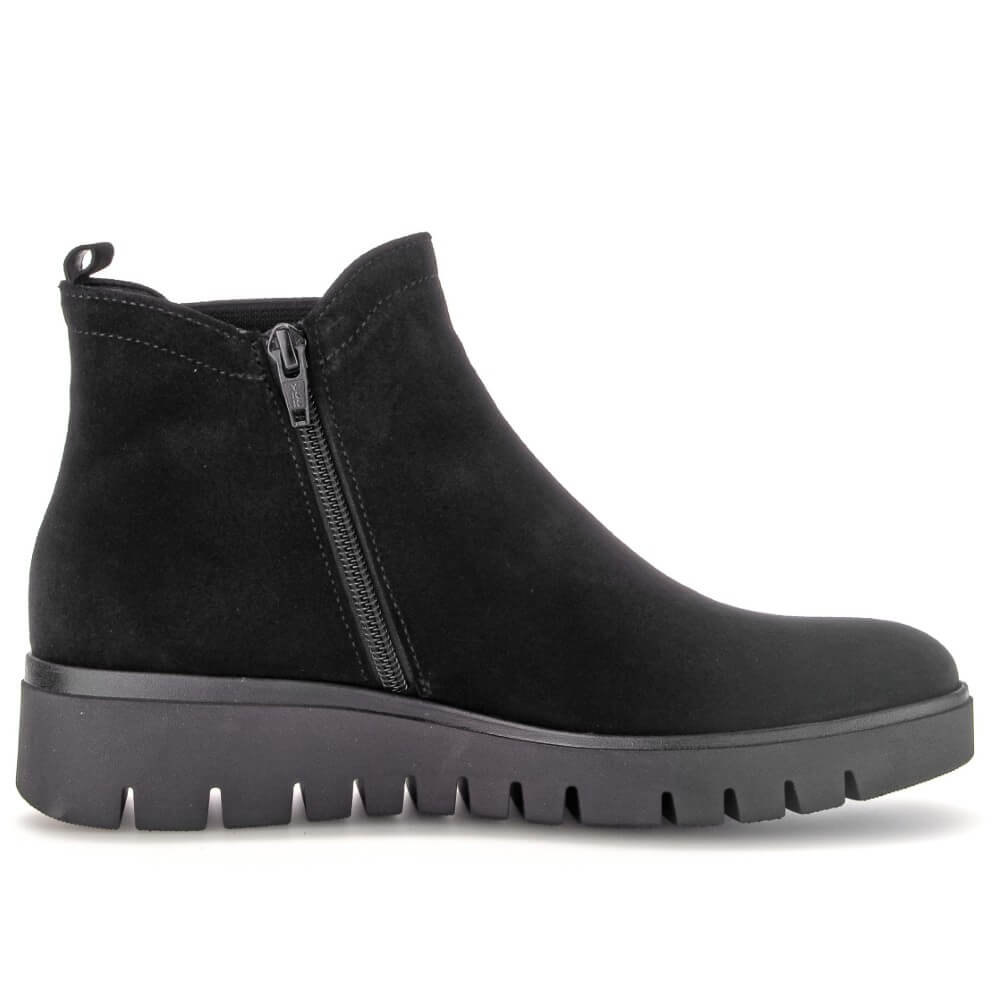 Black ankle boot with a zipper on a white background Gabor Dublin 72.061 Suede Ankle Boots combine classic Chelsea