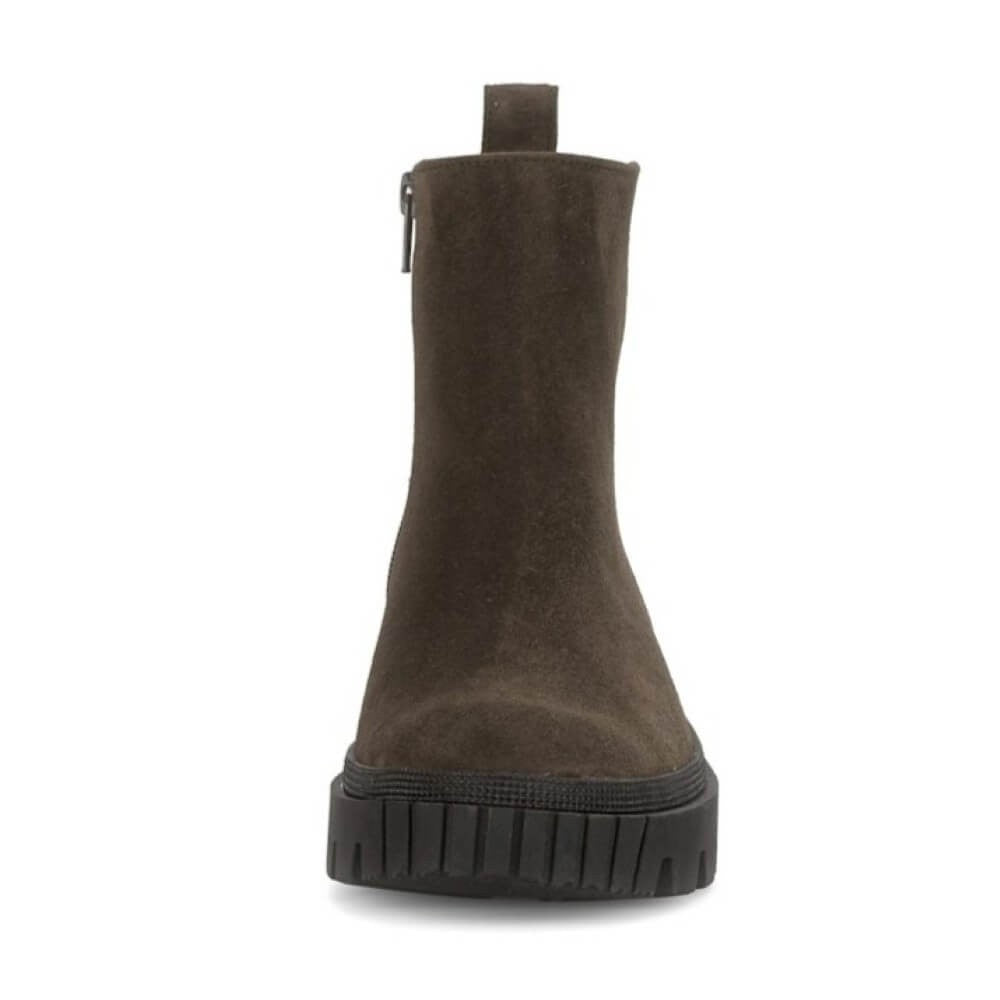 Brown suede boot on a white background