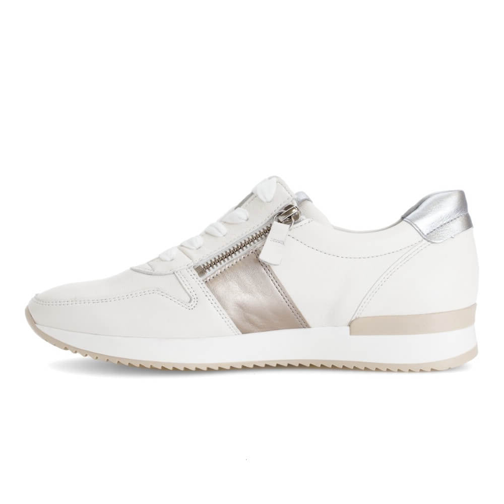 White sneaker with silver accents on a white background