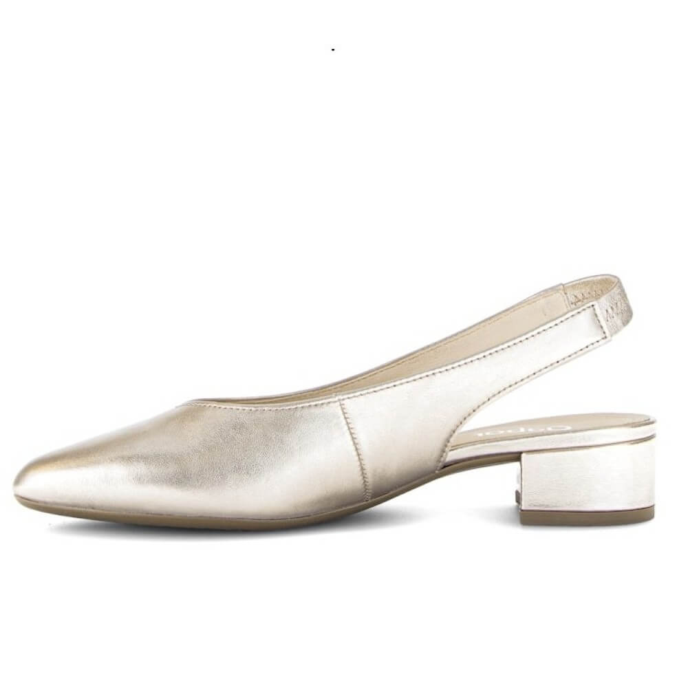 Gold slingback shoe on a white background