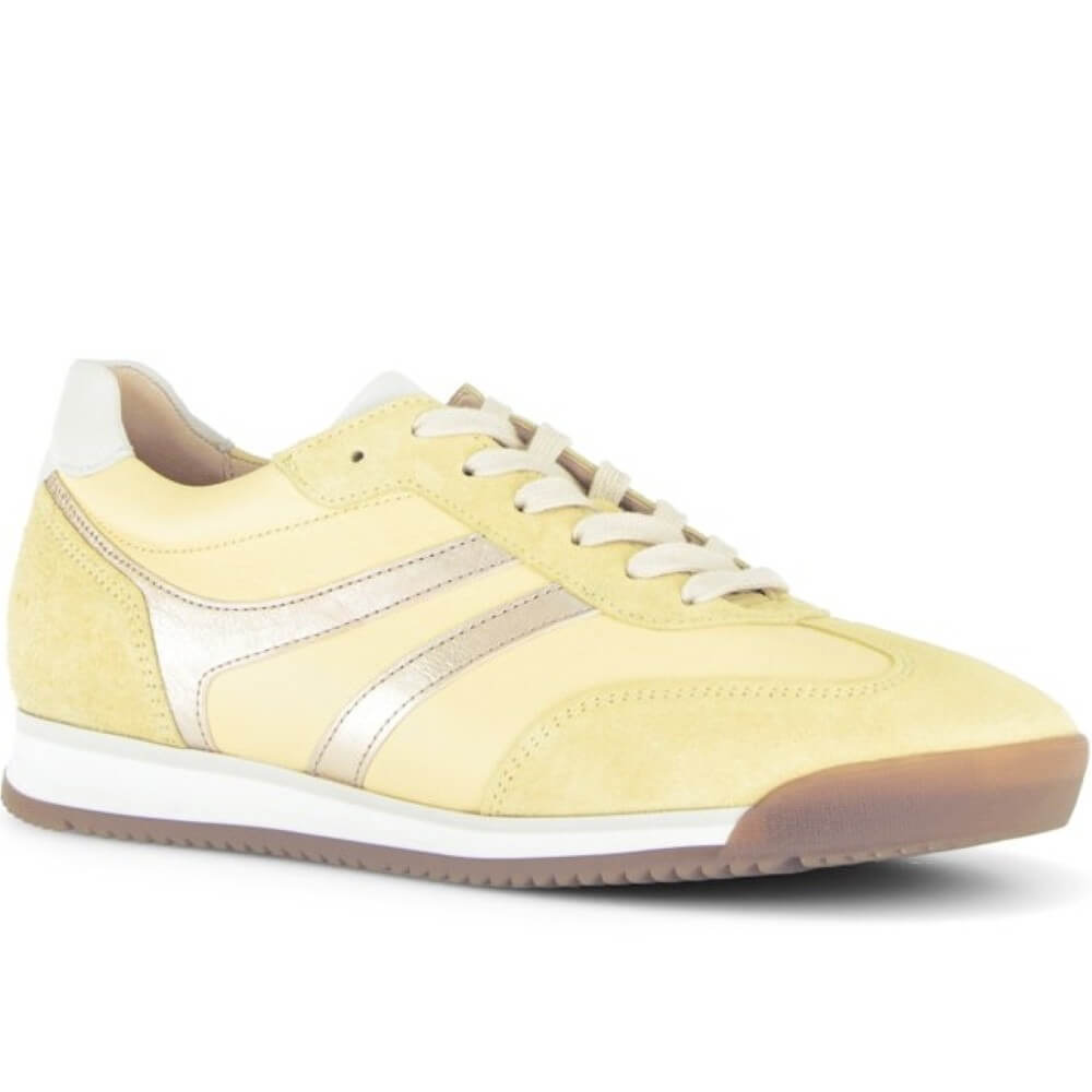 Yellow sneaker with white accents on a white background