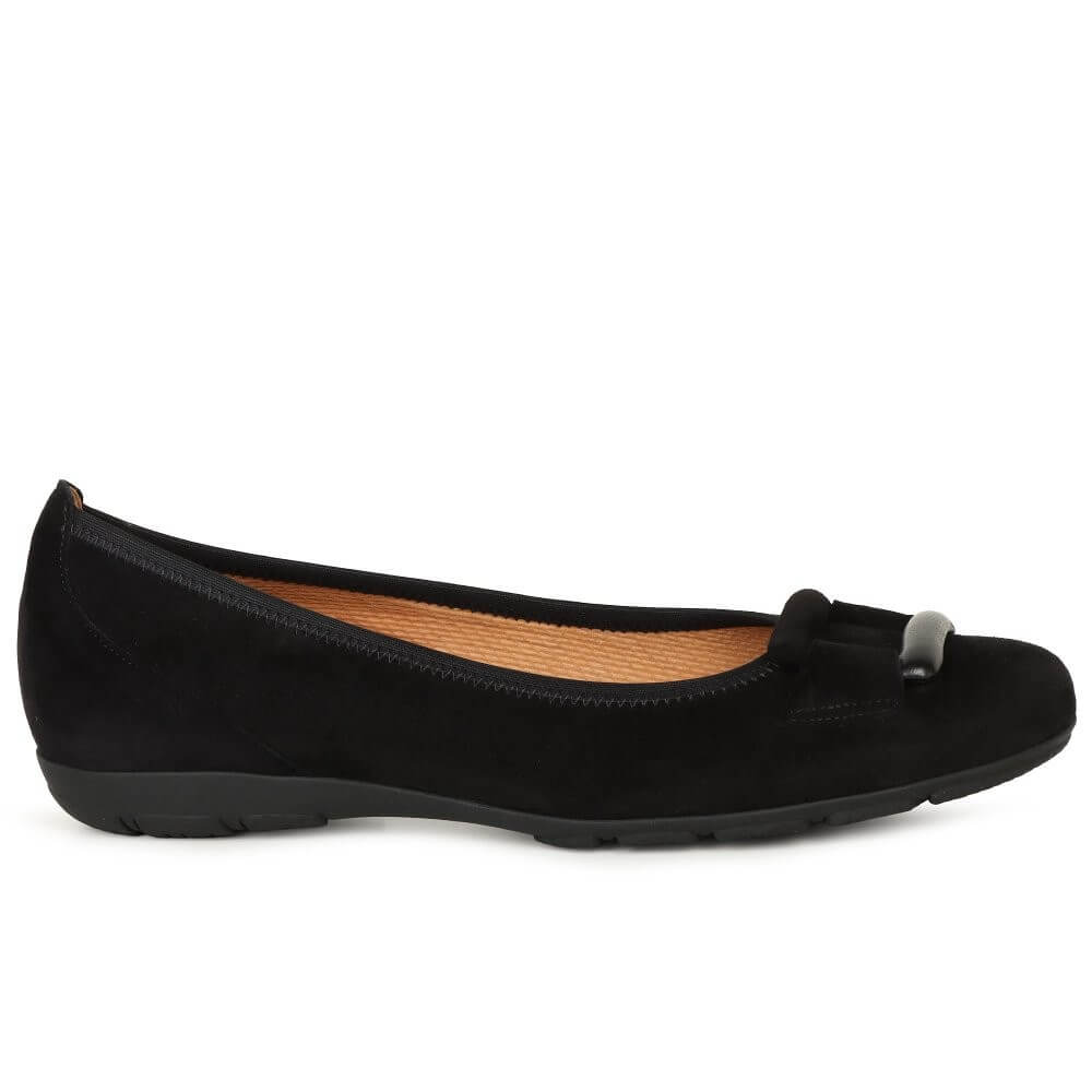 Black flat shoe with a detail on a white background