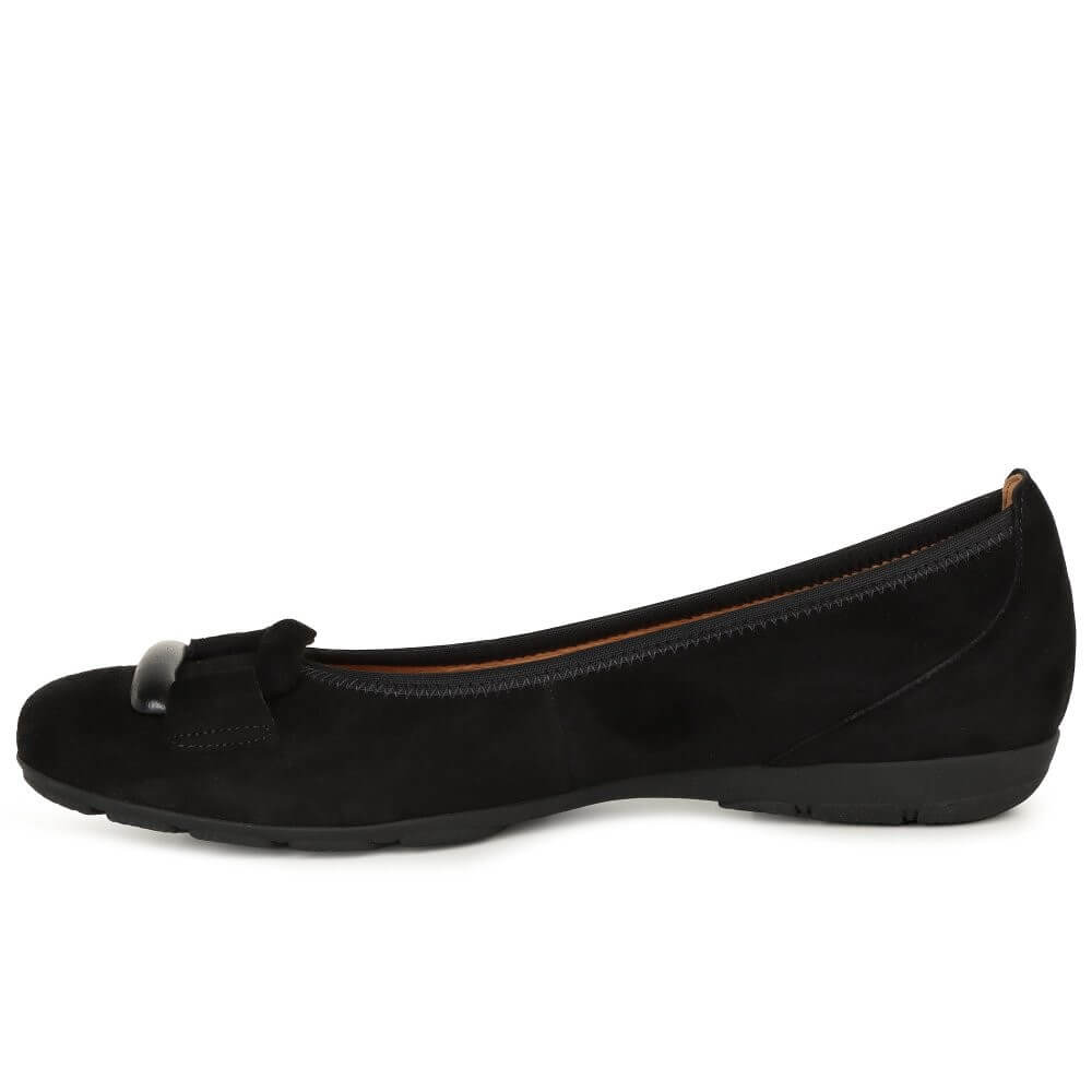 Black flat shoe with a detail on a white background