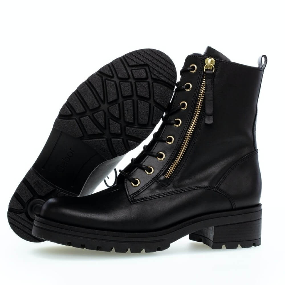 Black leather boot with two gold zipper sand laces on a white background Gabor Serve biker boots 72.785 Black