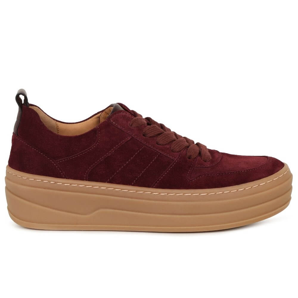 Maroon sneaker with a brown sole on a white background