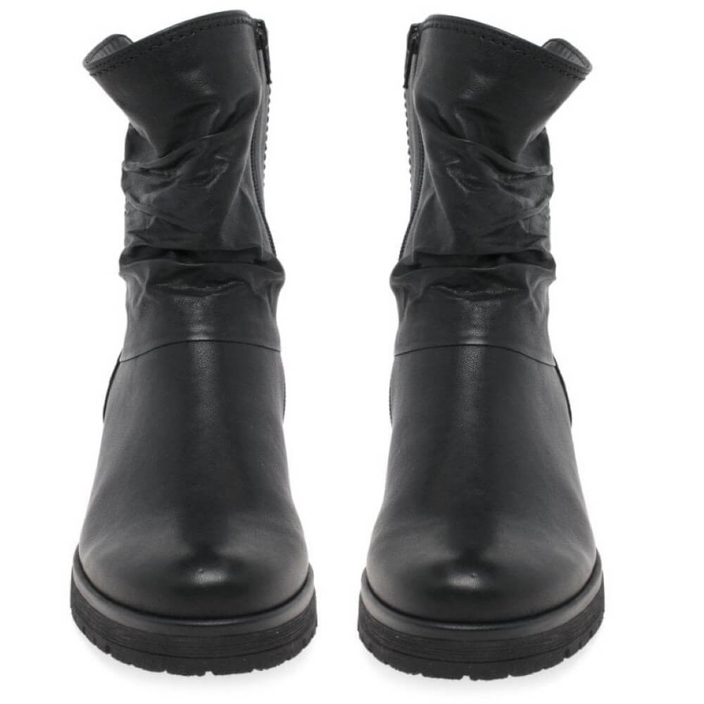 Pair of black leather boots on a white background