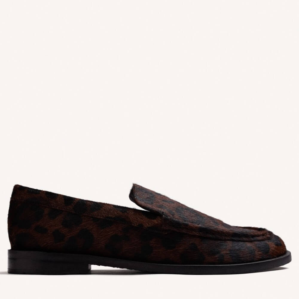 A Gioseppo brown and black leopard-print loafer shown in a side profile view against a plain off-white background.
