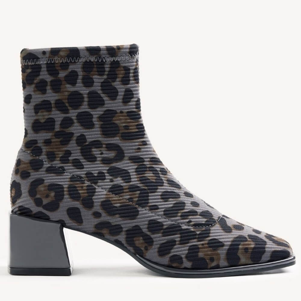 A Gioseppo ankle boot with a grey ribbed fabric upper featuring a black and brown leopard print, a low block heel, and a pointed toe, shown against a plain white background.