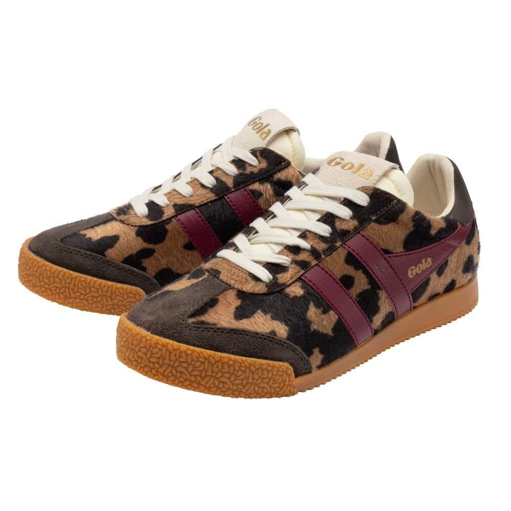 A pair of low-top sneakers with a brown and black leopard print pattern, burgundy side stripes, cream laces, and gum soles. The brand name 'Gola' is visible on the tongue and side.