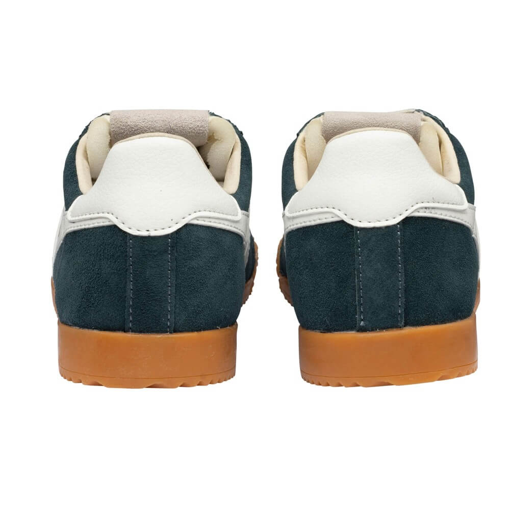 Pair of navy blue and white sneakers with brown soles on a white background