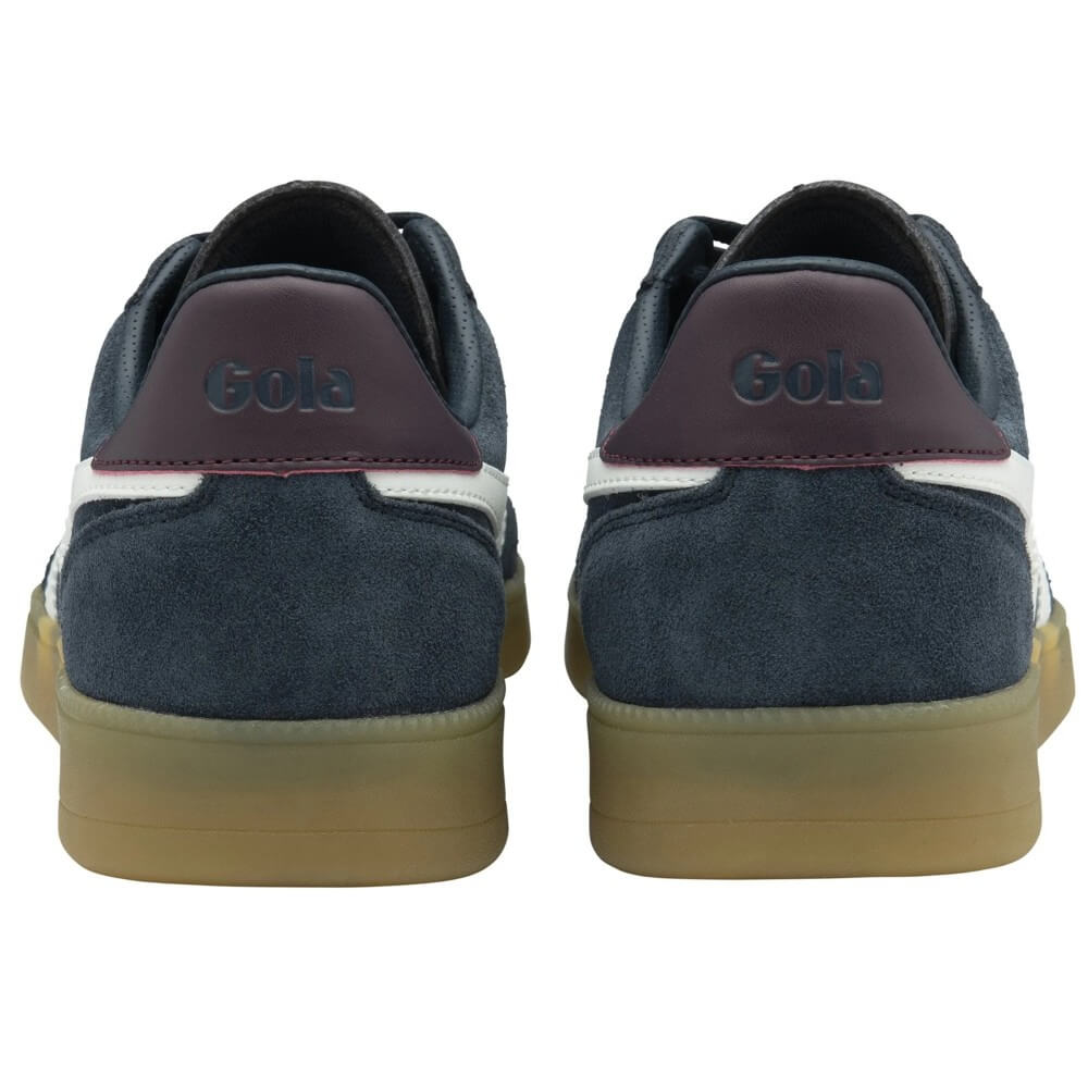 Pair of navy blue sneakers with brown soles on a white background