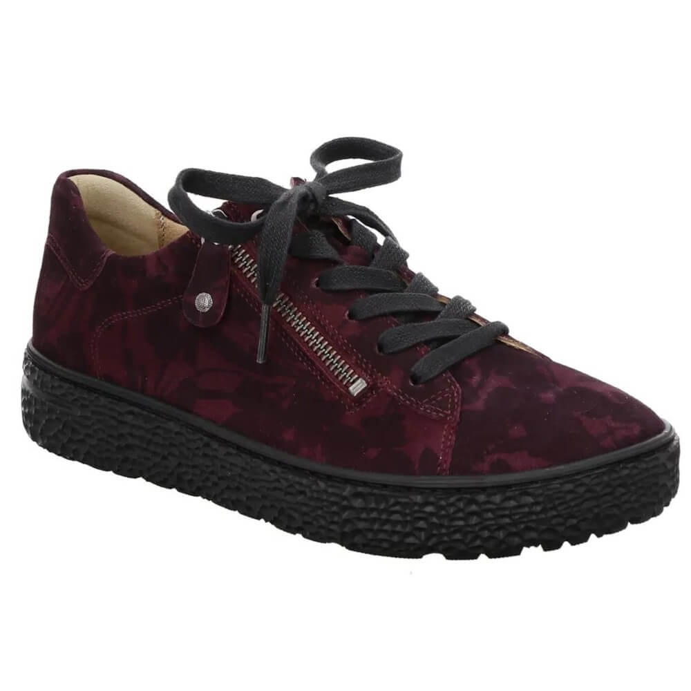 A Hartjes low-top sneaker in a deep burgundy and black floral patterned suede, featuring a side zipper, black laces, and a chunky black textured sole.