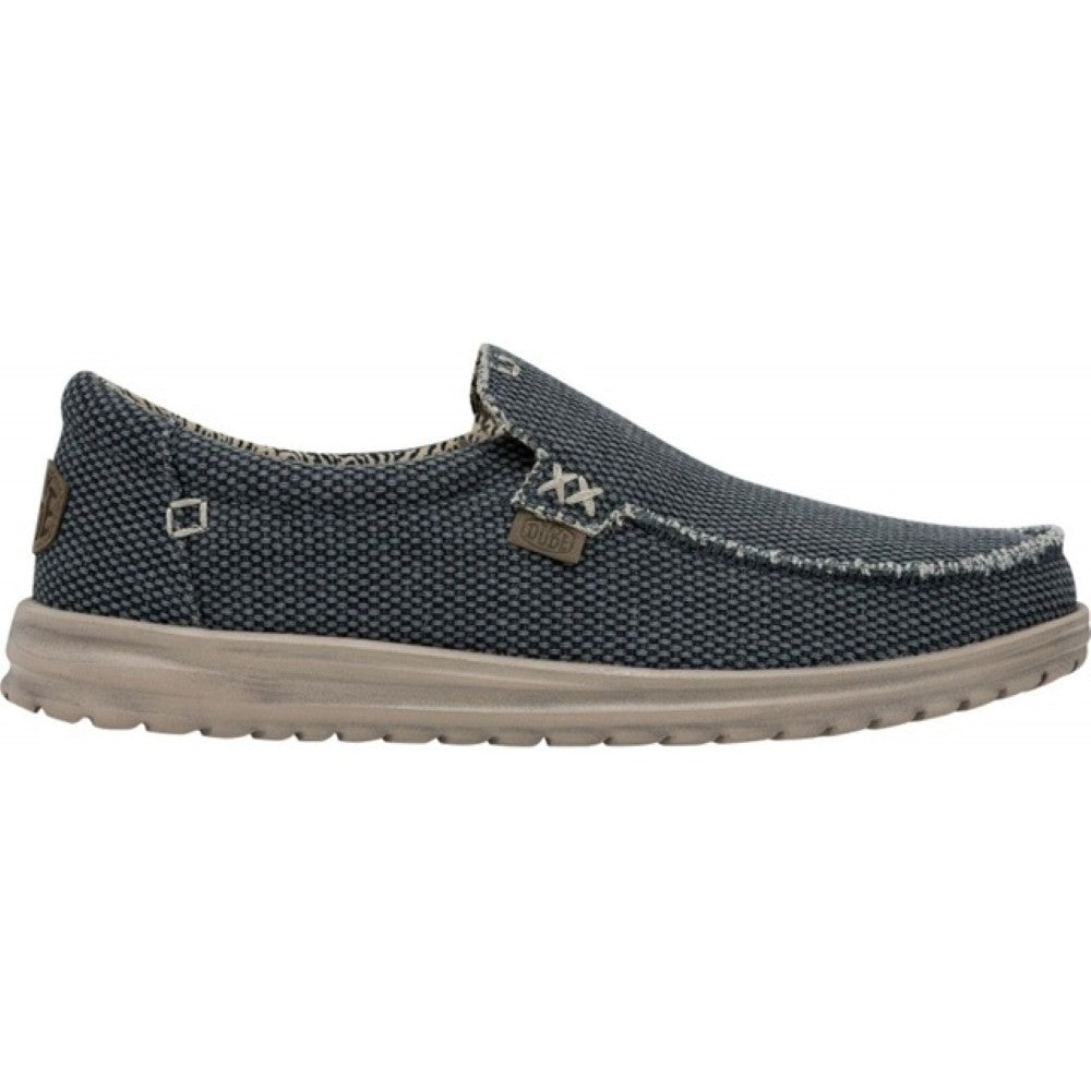 HeyDude Navy slip-on shoe with a textured pattern on a white background
