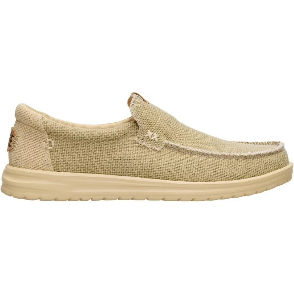 HeyDudeBeige slip-on shoe on a white background