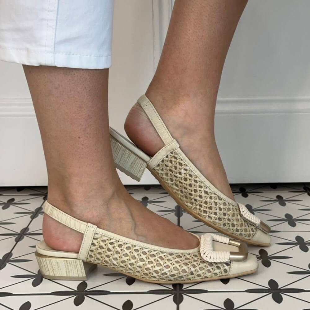 Hipanitas Beige mesh sandals worn by a person on a tiled floor.