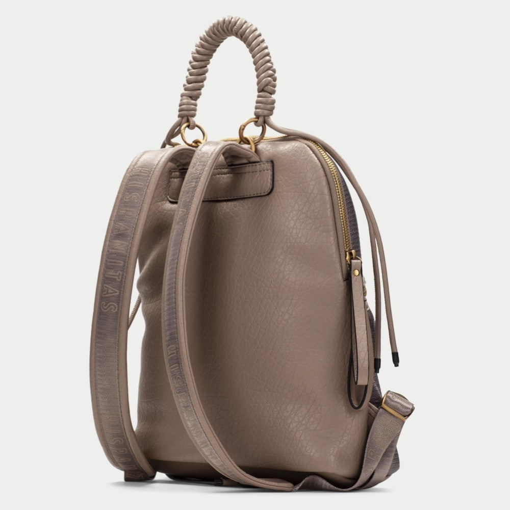 A Hispanitas textured metallic taupe backpack with a braided top handle, gold-tone zippers, and matching  straps, shown against a light grey background.