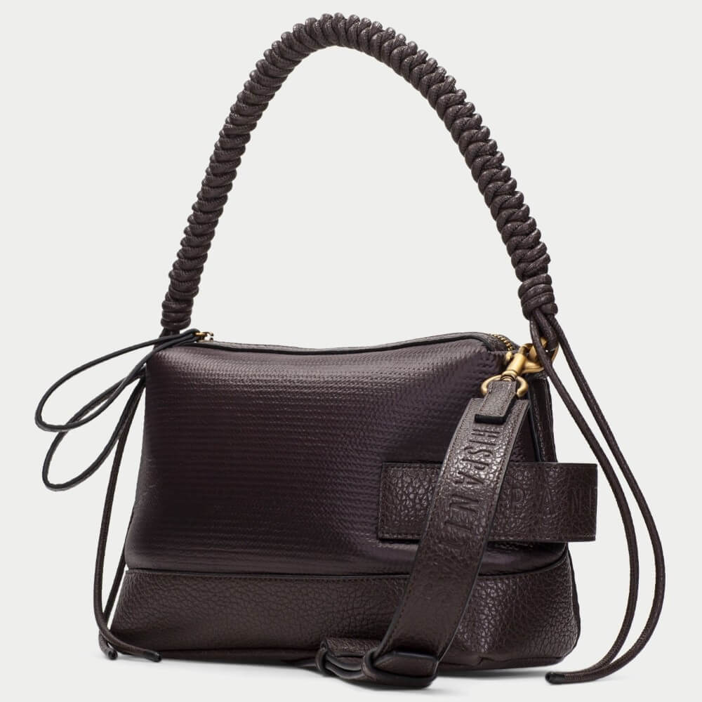 A Hispanitas dark brown textured handbag with a unique coiled shoulder strap and a small embossed brand patch on the front, set against a plain light grey background.
