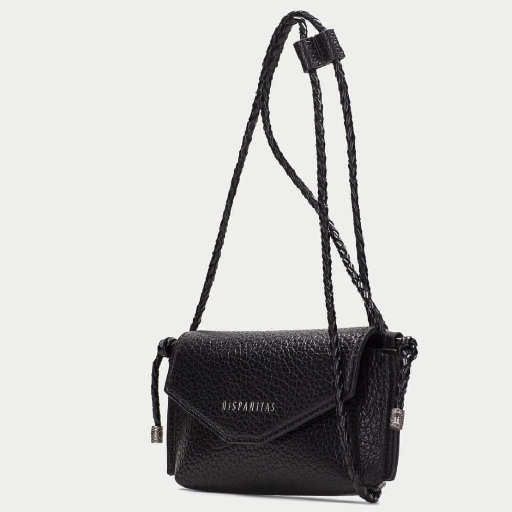 A burgundy pebbled PU leather clutch bag with a flap closure and braided strap details, featuring the brand name 'HISPANITAS' in silver lettering on the front, set against a plain light gray background.