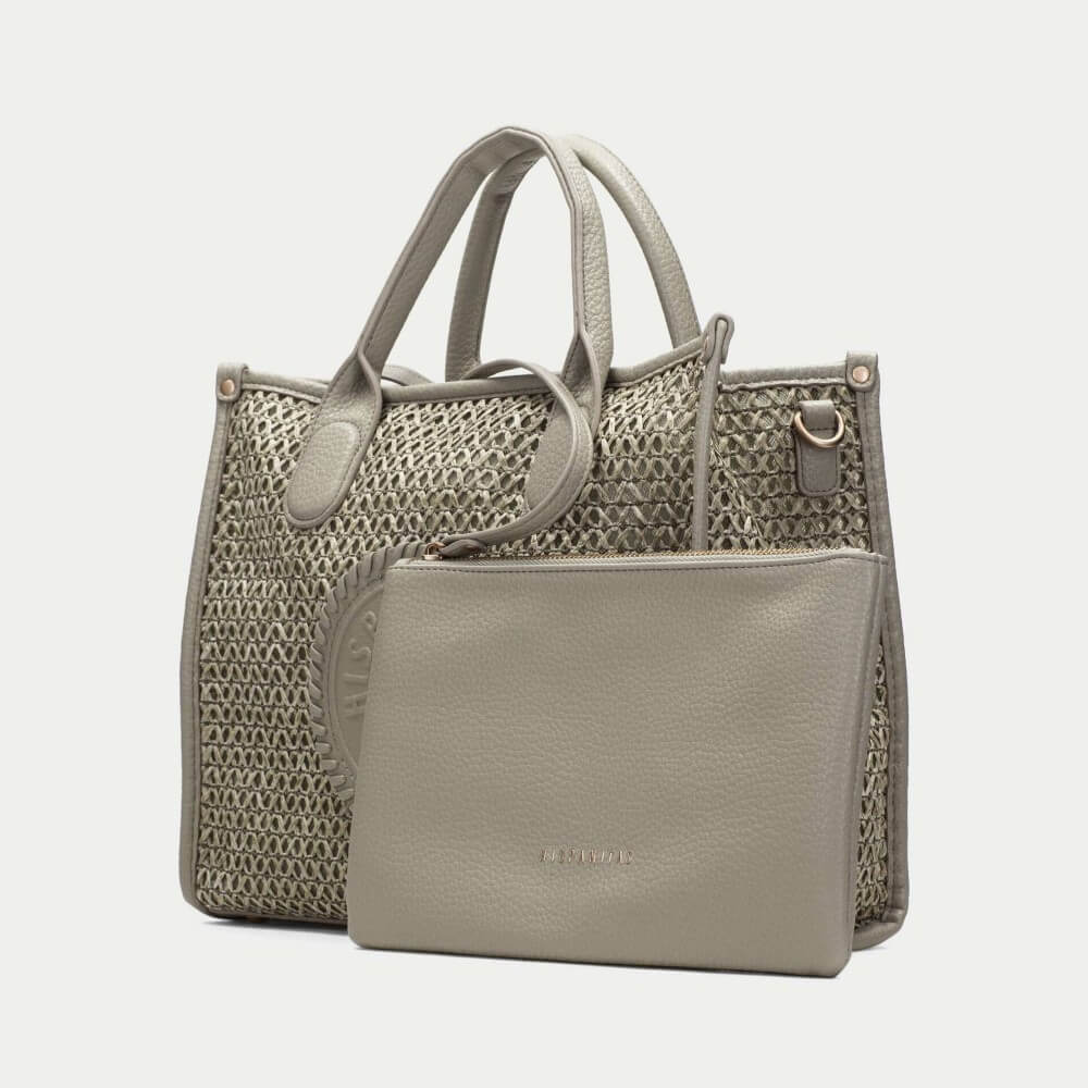 Hispanitas green textured handbag with brand logo on a light grey background