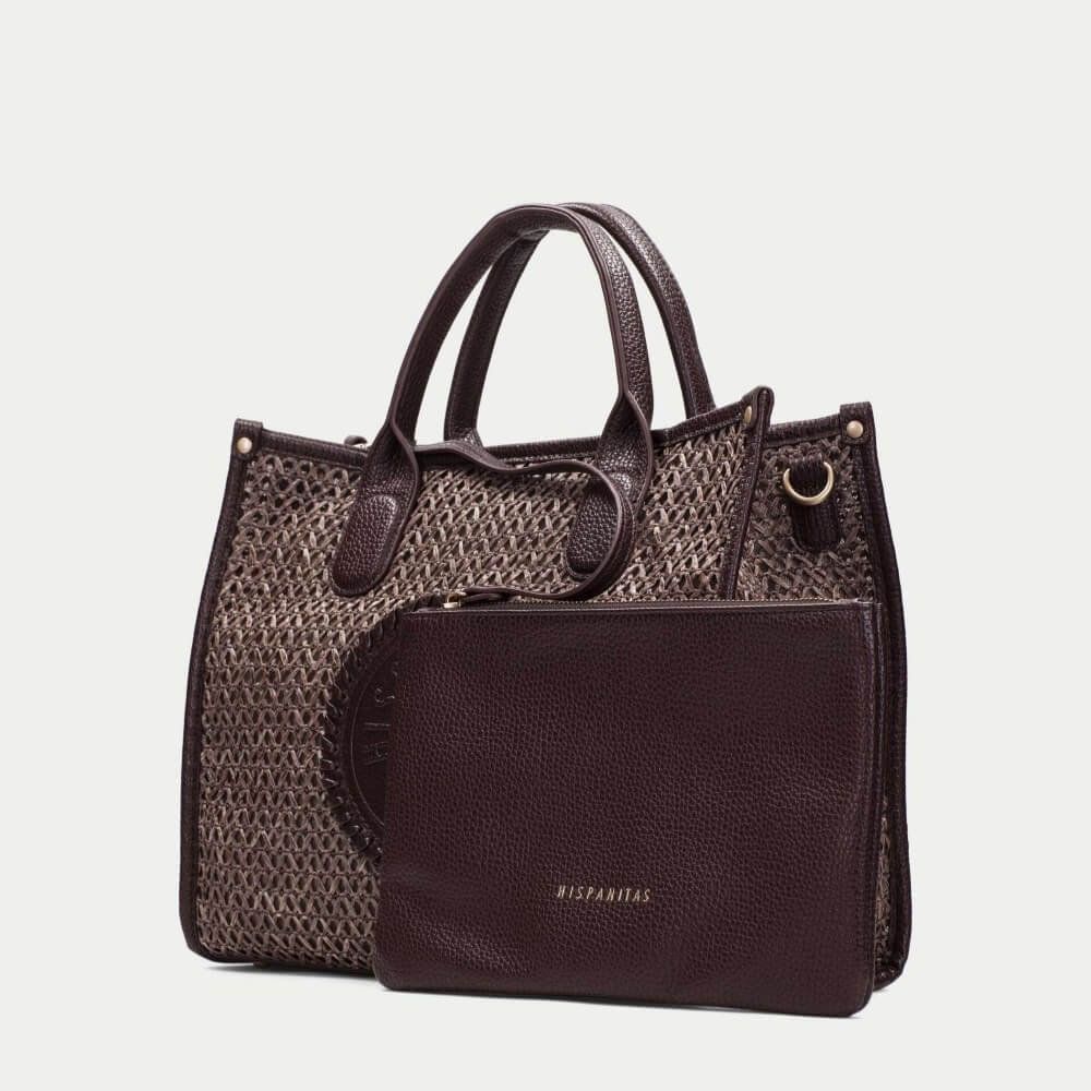 Hispanitas Brown woven handbag with a circular logo on a light grey background