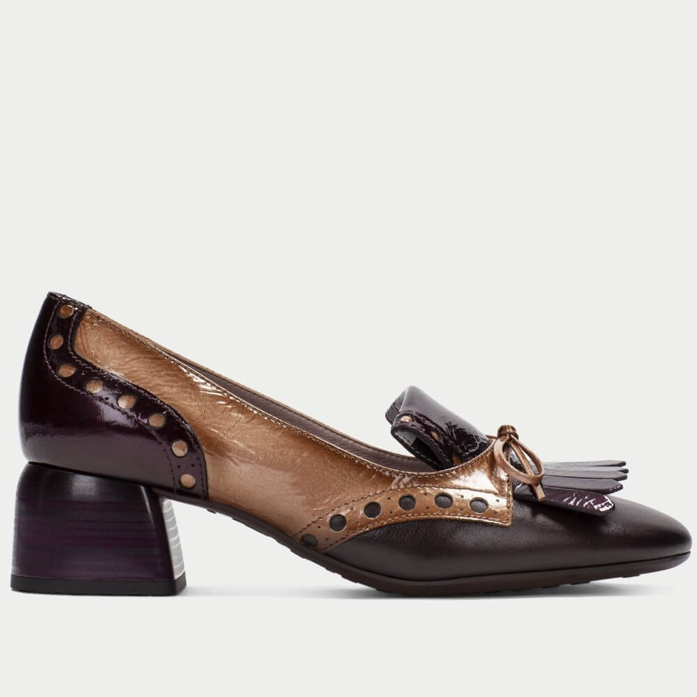  Hispanitas women's block-heel pump featuring a colour-blocked design with glossy dark plum leather, tan leather, and silver-tone decorative studs, shown against a light grey background.