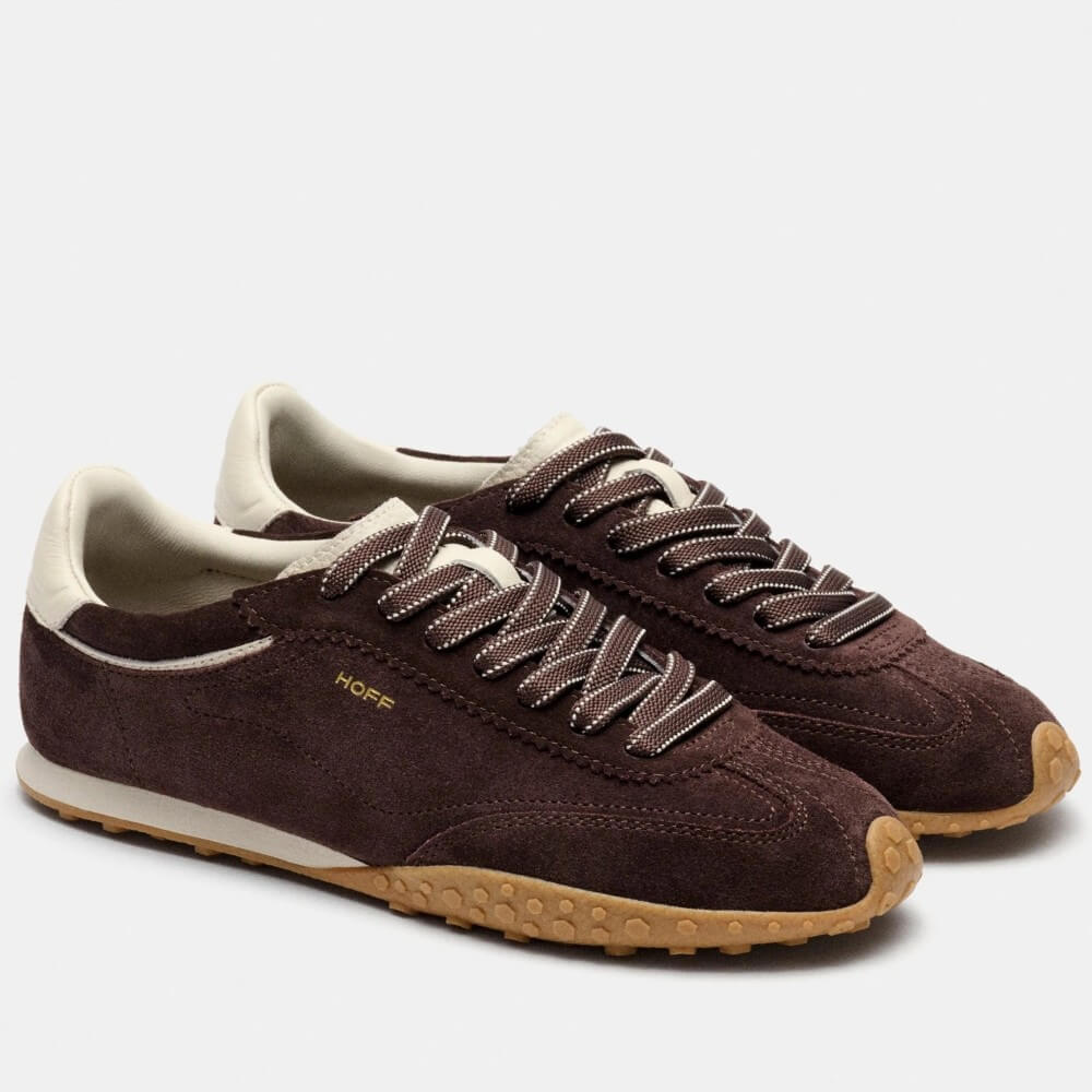 A pair of Hoff dark brown suede sneakers with cream lining, brown-and-white laces, and tan rubber soles, shown on a light grey background. The word 'HOFF' is printed in gold on the side of the front shoe.