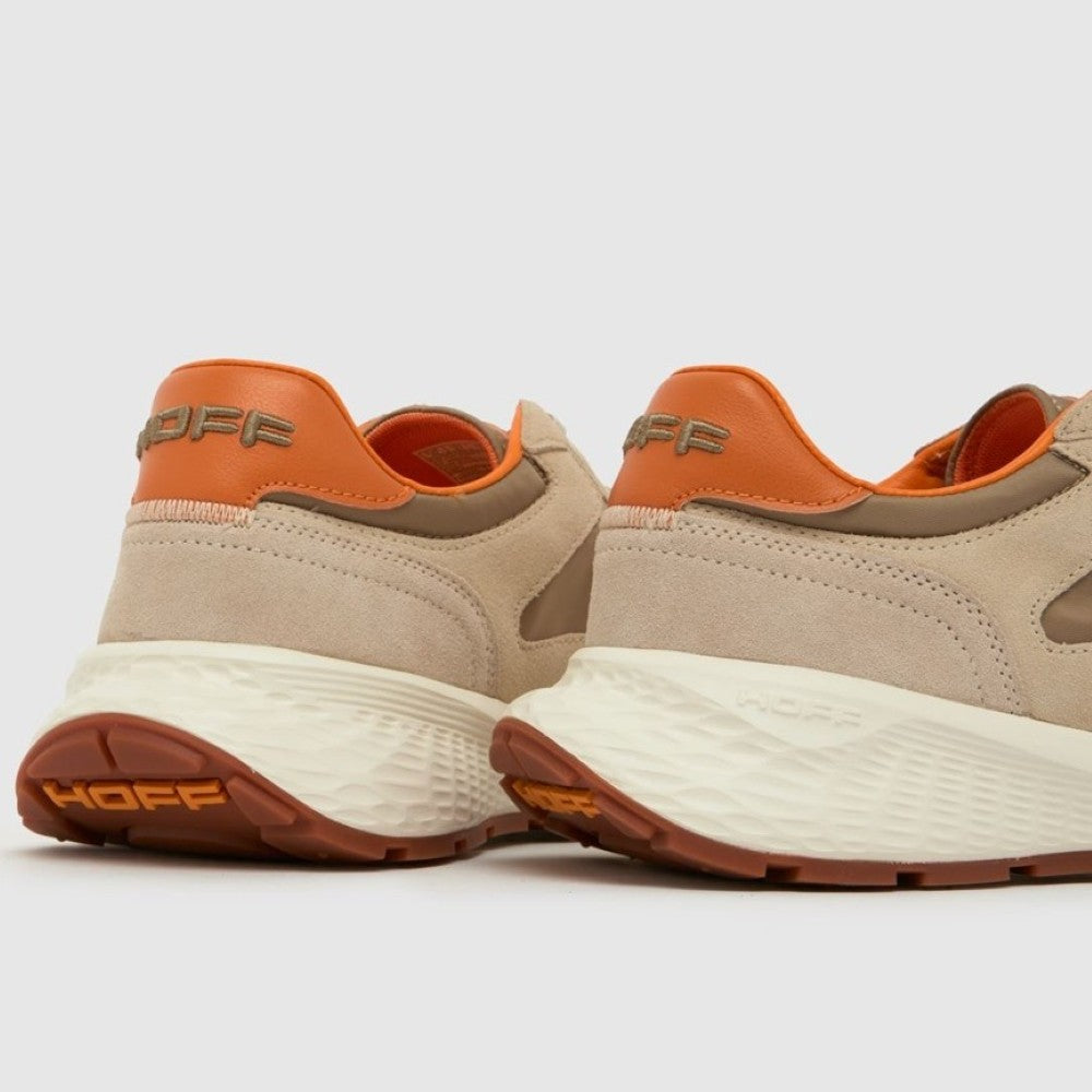 Pair of beige and orange sneakers with 'HOFF' branding on a light gray background