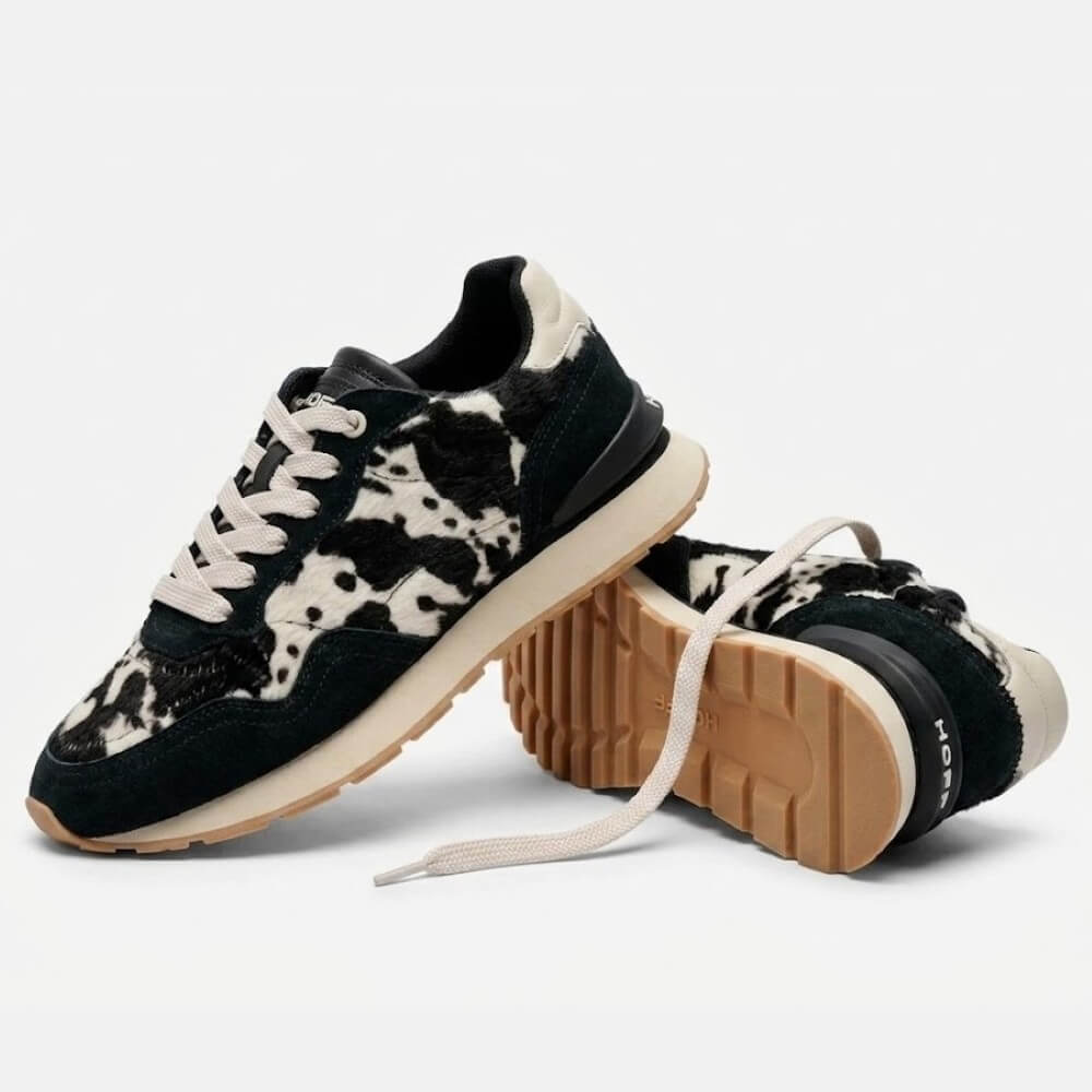 A pair of Hoff  upper, black laces, a cream midsole, and a tan rubber outsole. One shoe is upright and the other is lying on its side showing the treaded sole.