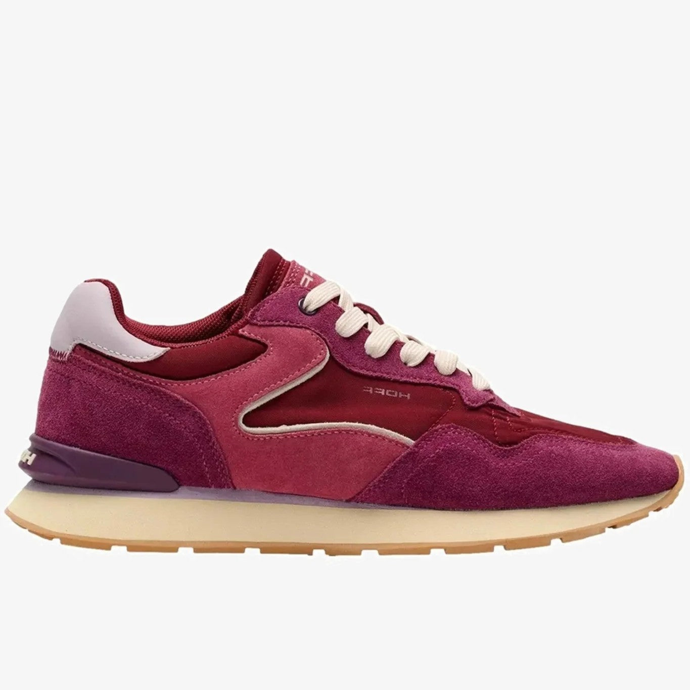 A low-Hoff top sneaker in cherry red and magenta suede with cream laces and a beige midsole, shown from a side profile on a light grey background.