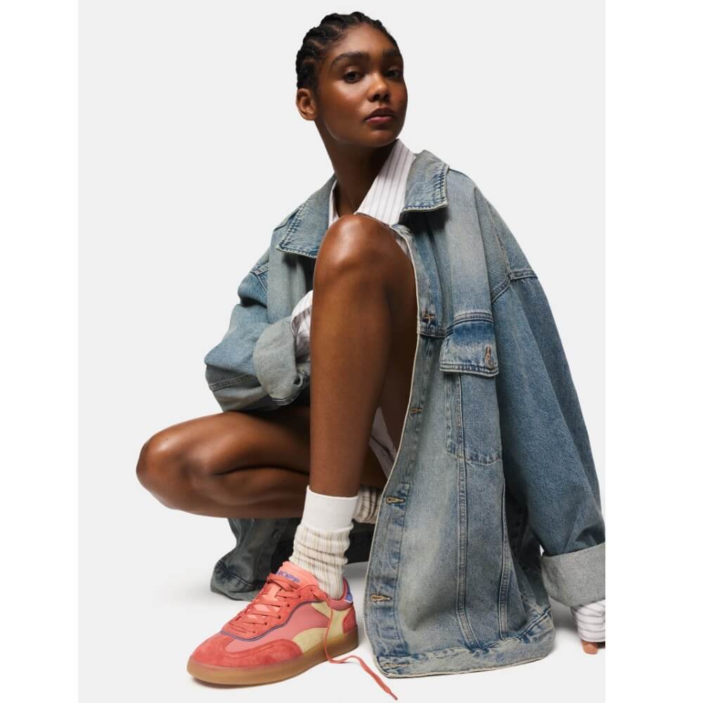 Person wearing a denim jacket and colorful sneakers on a white background Hoff Park Sneakers