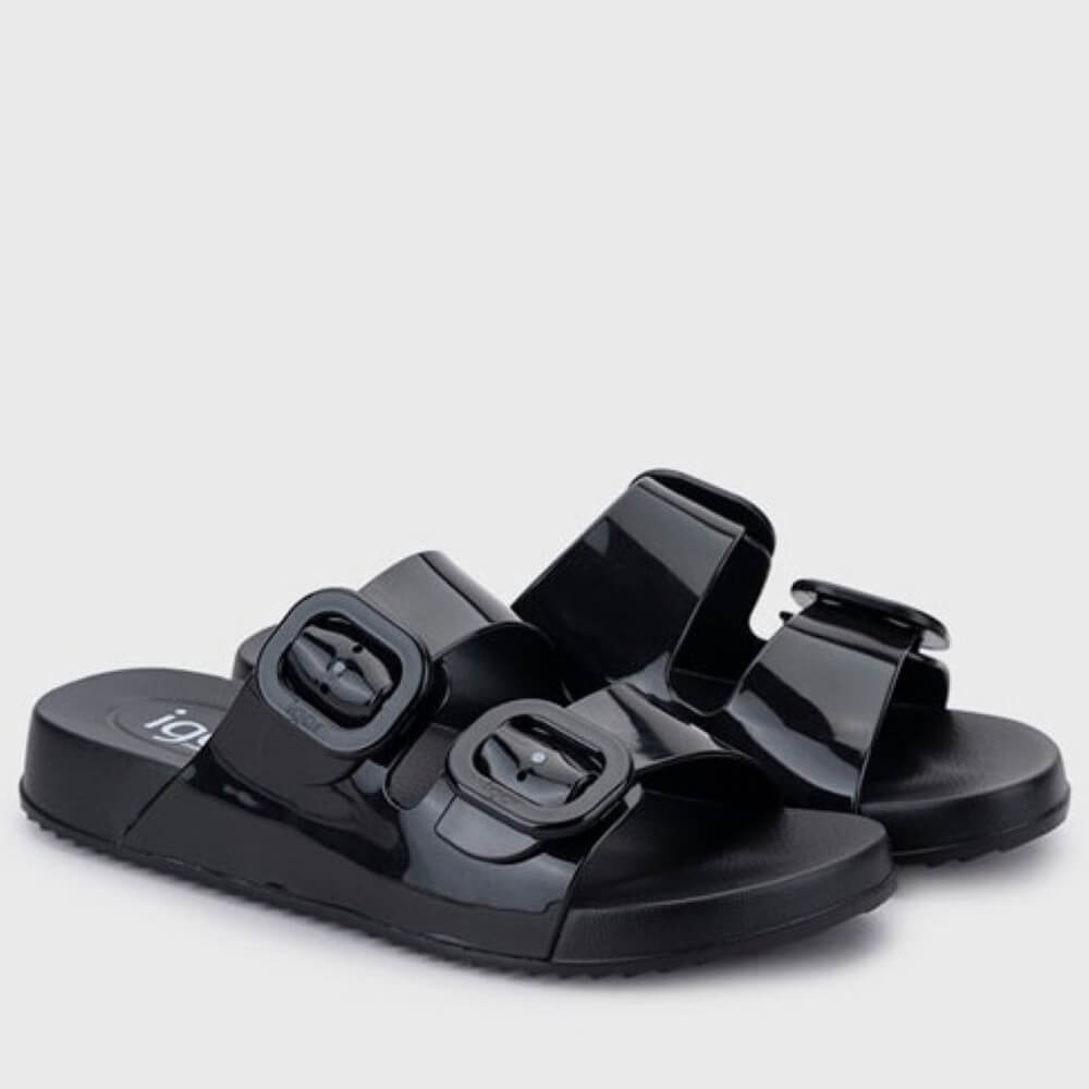 Igor Black sandals with buckle straps on a light grey background