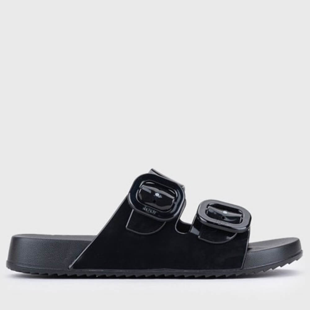 Igor Black sandals with buckle straps on a light grey background
