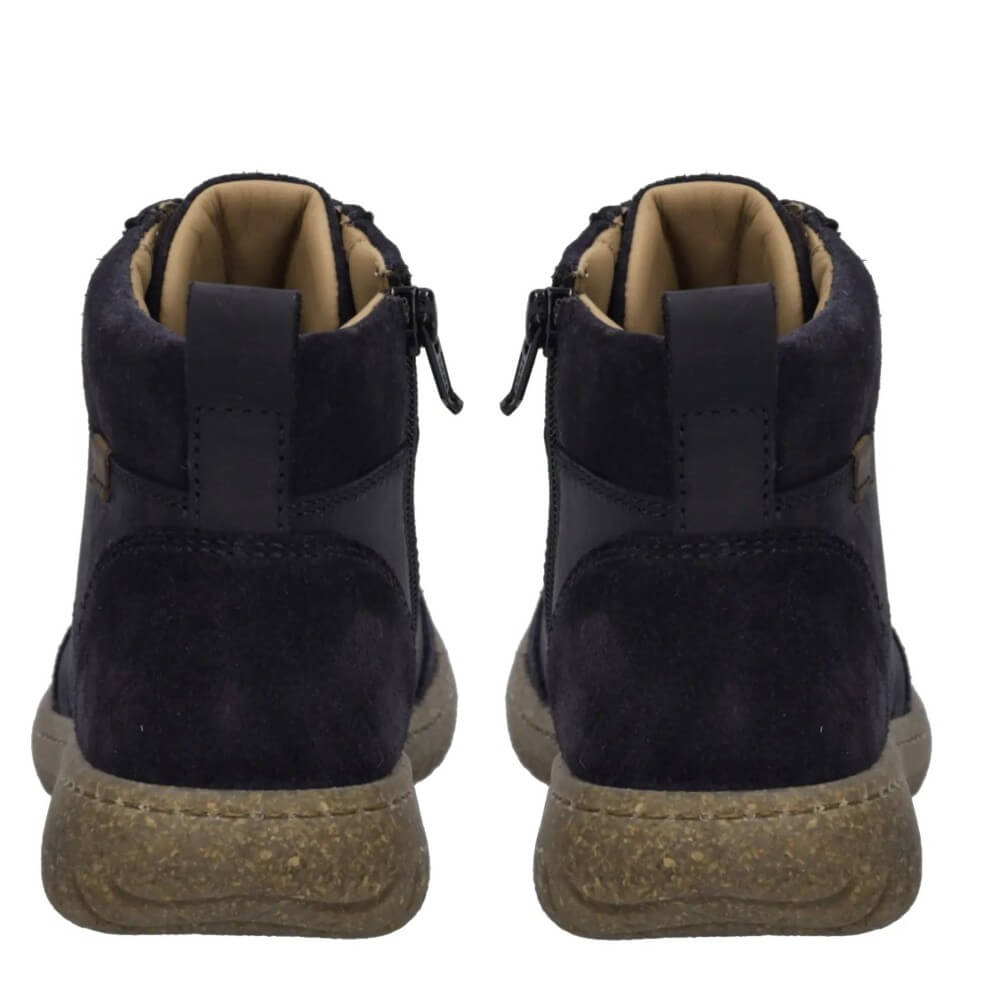 A pair of navy suede ankle boots with tan lining and brown textured soles, shown from the back on a white background.