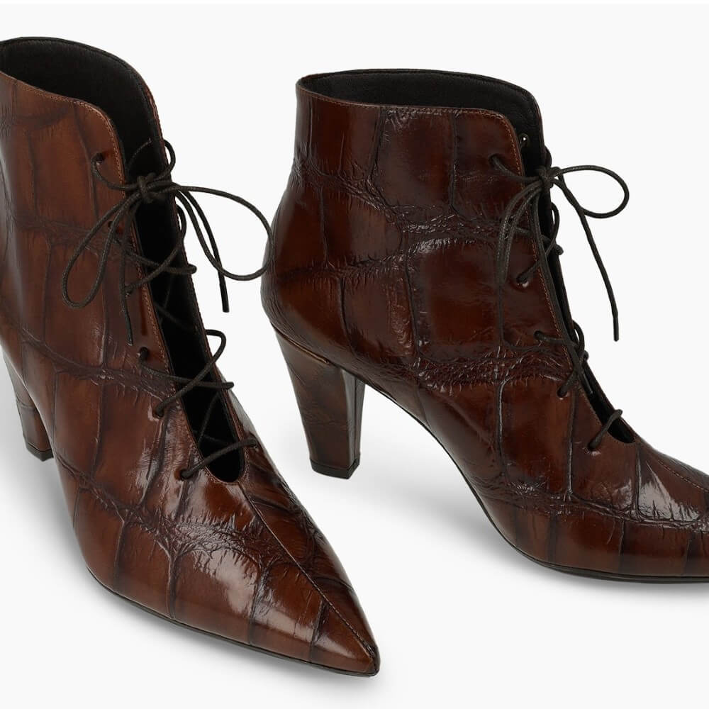 A pair of Lodi brown lace-up ankle boots with a glossy crocodile-embossed texture and block heels, shown on a clean white background.