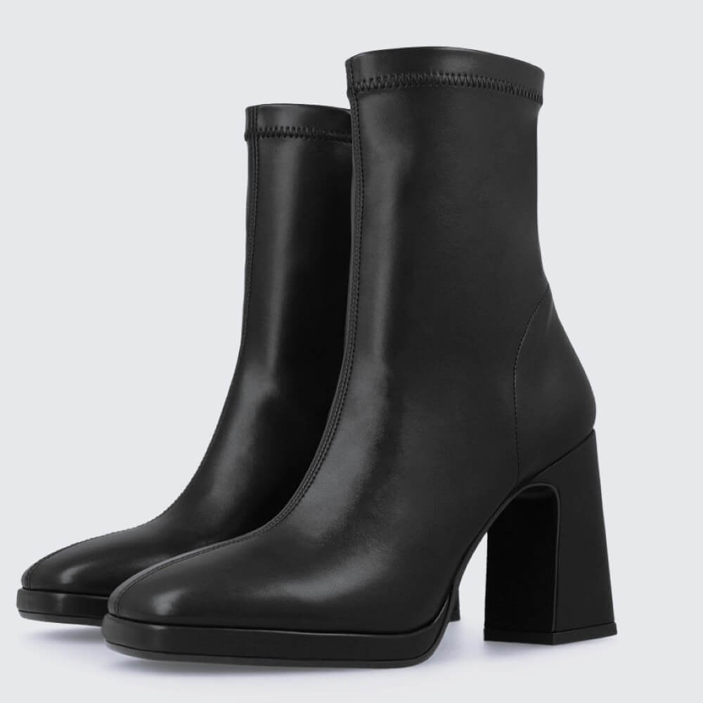 Black ankle boot with a block heel on a light gray background Lodi A-LAIRA Ankle Boots