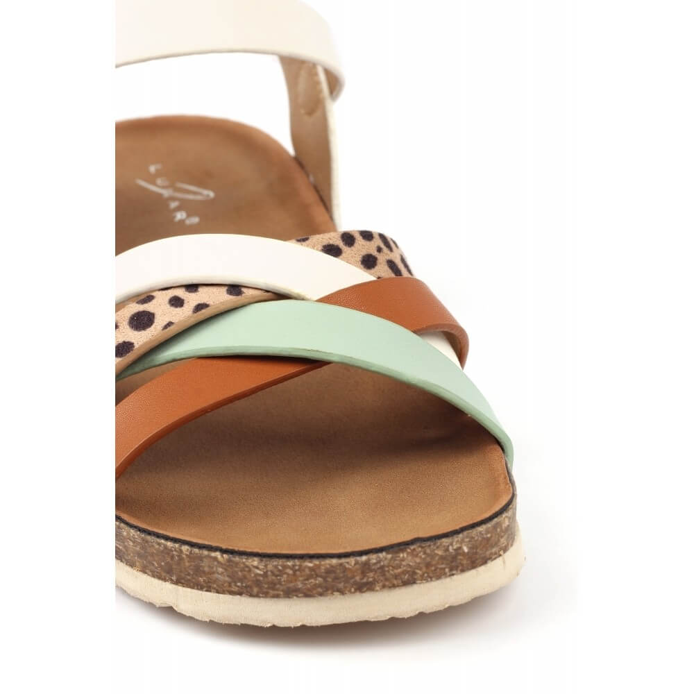 Lunar Multi-coloured sandal with a cork wedge sole on a white 