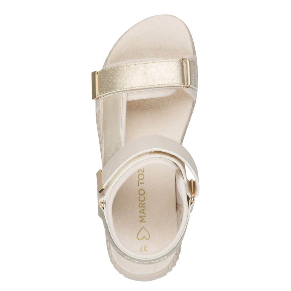 Marco Tozzi Gold and Beige sandal with a '100% vegan' tag on a white background