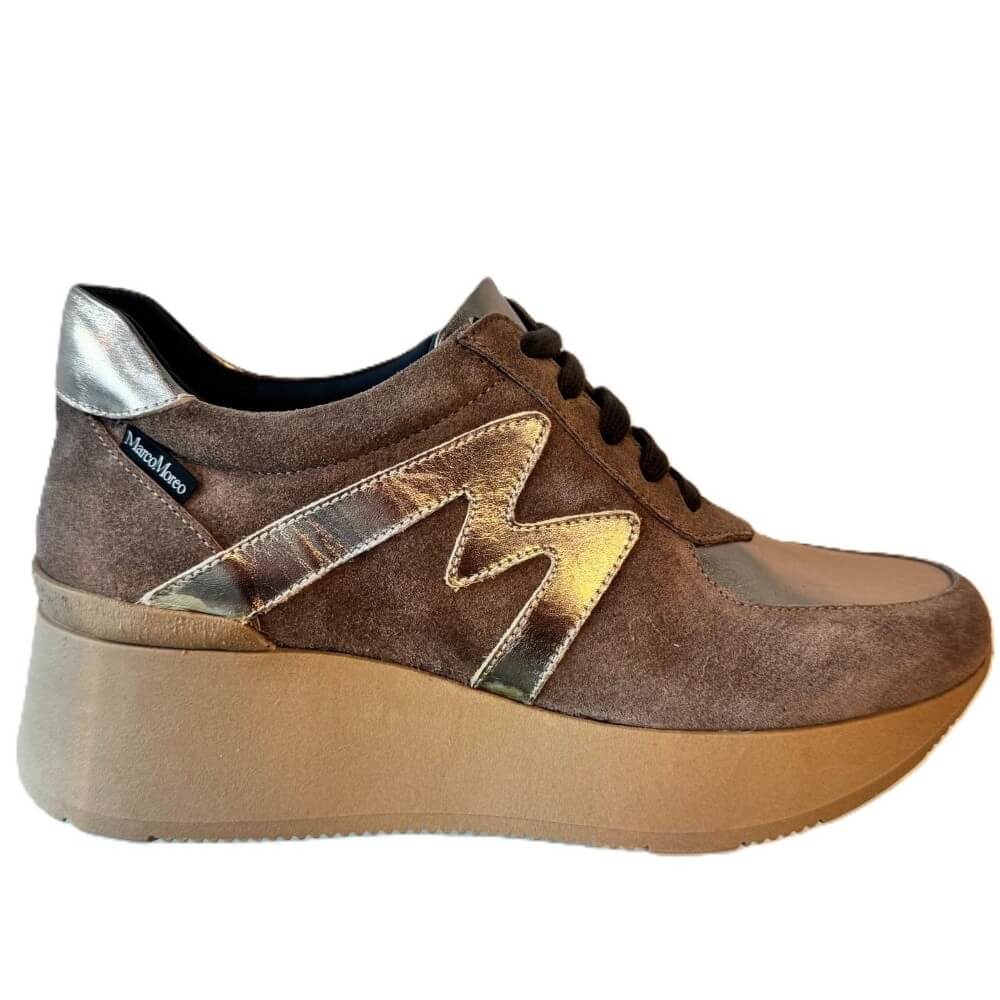 Marco Moreo platform sneaker in brown suede and beige synthetic material, featuring metallic silver heel caps and a large silver 'M' logo on the side, set against a light grey background.
