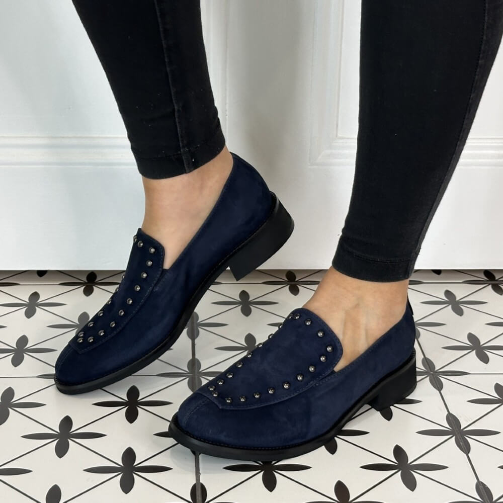 Navy blue loafers with studded details worn indoors on a patterned floor.  Marco Moreo Suede Loafer 