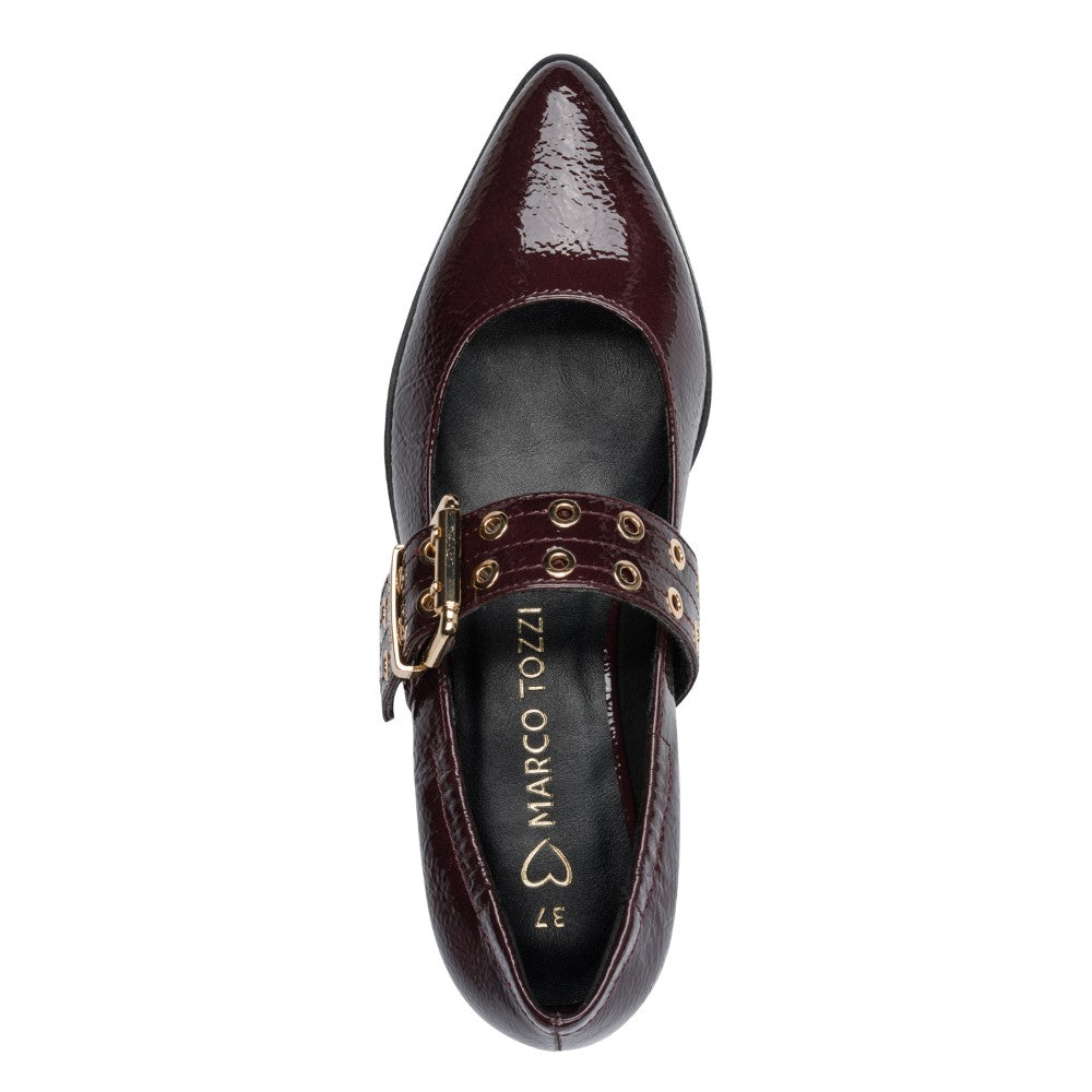 Marco Tozzi wine patent leather shoe with gold buckle on a white background