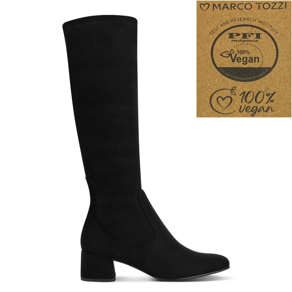 A black knee-high boot with a block heel, shown in profile on a white background. In the top right corner, there is a square graphic featuring the Marco Tozzi logo and a '100% Vegan' certification seal.