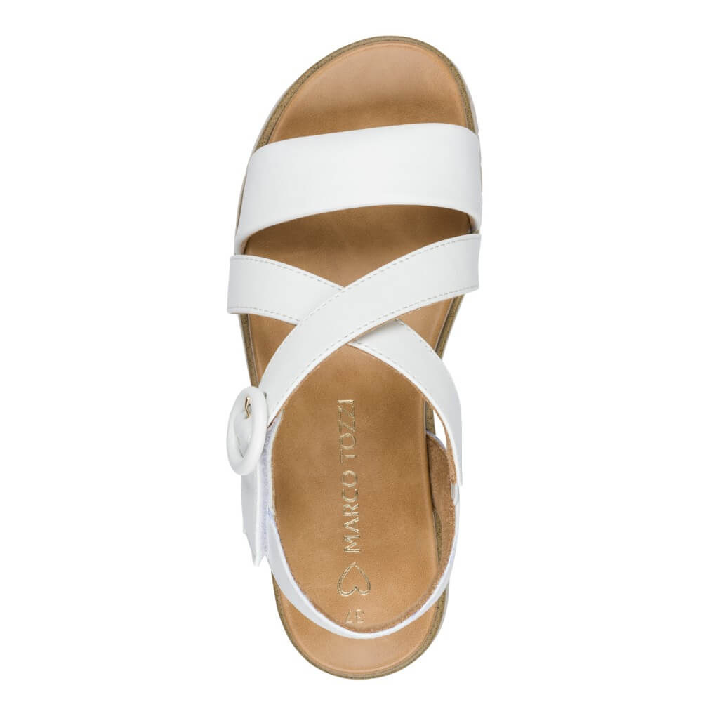 Marco Tozzi White sandal with cork platform and '100% vegan' tag on a white background