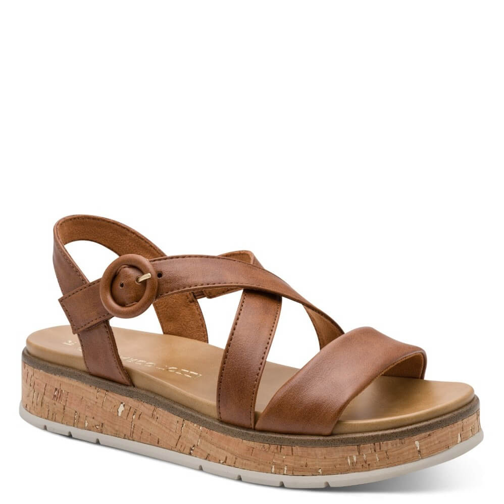 Marco Tozzi Brown sandal with cork platform and '100% vegan' tag on a white background