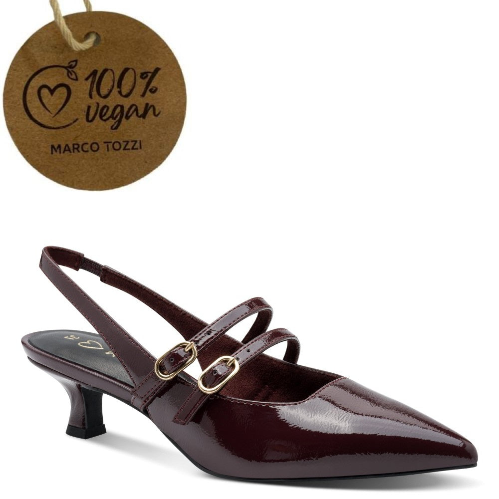 A Marco Tozzi  pointed-toe slingback heeled shoe in glossy dark burgundy patent leather with double straps and gold-tone hardware, shown on a white background with a hanging brown paper tag reading 100% vegan MARCO TOZZI.